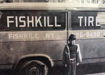 Fishkill, NY black and white picture, kid in front of a van.